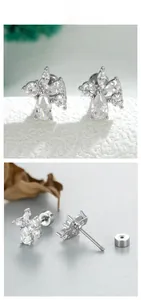 Detail of silver cartilage stud earring featuring pear-cut cubic zirconia and screw-back