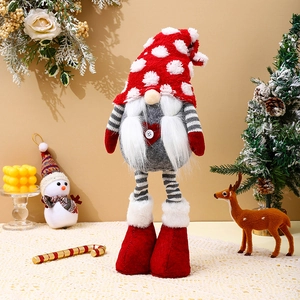 Close-up of a long-legged Christmas gnome with a polka-dot knit hat and heart button detail