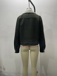 Detail of dark green corduroy jacket with white faux shearling collar and ribbed texture