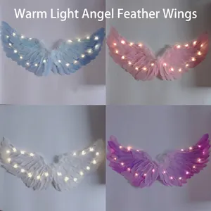 Ali d'angelo in piuma luminose con LED per spettacoli di bambini in quattro colori diversi