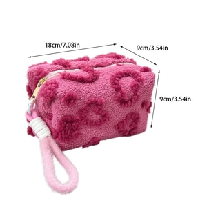 Pink plush cosmetics bag dimensions 18x9x9cm with soft texture and cord handle detail