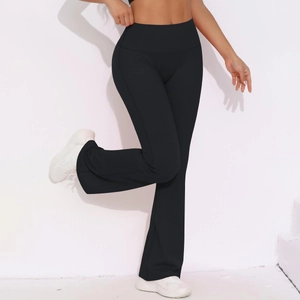 Detail of high-waist flared yoga pants featuring black elastic breathable fabric