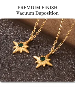 Macro view of two PVD plated gold necklaces with green starburst pendants