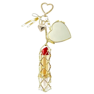 Golden lipstick holder keychain with heart mirror and mesh sleeve on white background