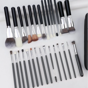 Detail view of 32pcs professional makeup brush set with black handles and silver ferrules
