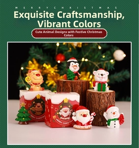 Miniature Christmas resin figurines on wooden logs with festive holiday light background