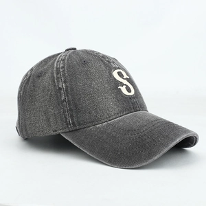 Detail of vintage washed denim baseball cap with premium 3D embroidered S letter