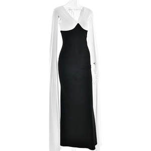 Detail of elegant two-tone dress featuring a deep V-neckline and flowing white streamers