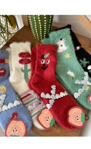 Detail of plush mink fleece socks with cute cartoon ornaments and lace trim edges