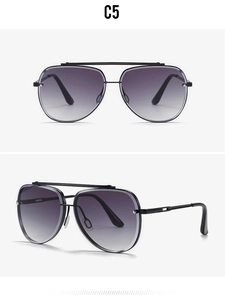 Detail view of double-bridge aviator sunglasses with gradient purple lenses and black frame