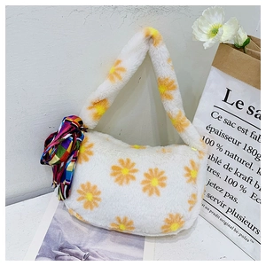 Detail of white plush shoulder bag with daisy pattern and colorful silk scarf accent