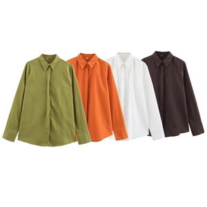 Linen shirts for women in green orange white and coffee colors laid flat on white background