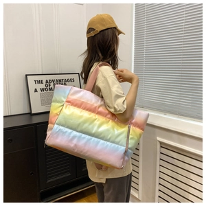 Detailed view of the quilted rainbow gradient texture on this large capacity fitness bag