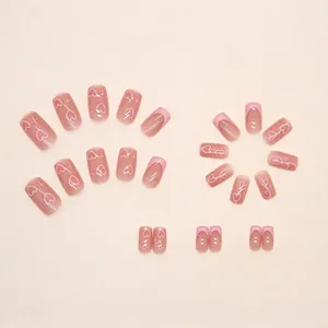 Pink heart and star press-on nails with French tip design in a minimalist style