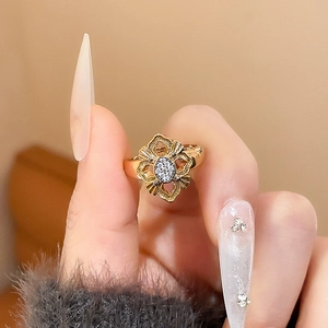 Macro shot of 24K gold plated hollow floral ring with sparkling zircon stones