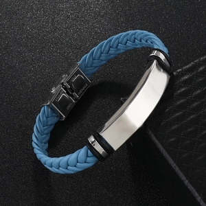 Macro detail of blue braided leather bracelet with silver stainless steel clasp