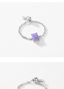 Macro shot of S925 sterling silver chain ring with purple opal stone and slider clasp