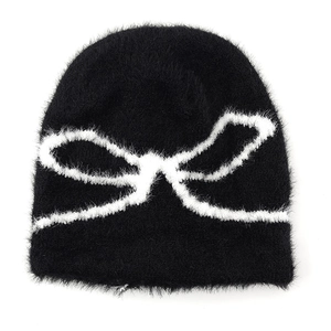 Fuzzy black knit beanie with white bow jacquard pattern for autumn winter warmth