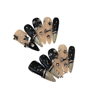 Handmade black and pink press-on nails with 3D stars and sparkling rhinestones
