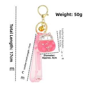 Pink Lucky Cat keychain with liquid glitter, golden hardware and 17cm total length detail