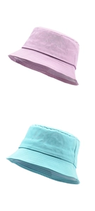 Detail view of cotton bucket hats in purple and lake blue with fine stitching texture