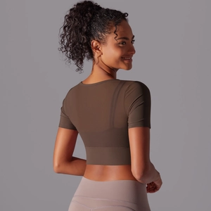 Slim fit dark coffee short sleeve yoga top with breathable fabric shown on a model