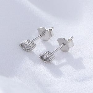 Minimalist sterling silver marquise stud earrings with zircon inlay on white fabric
