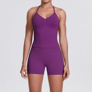 Detail of purple seamless yoga set with ruched sports bra and high waisted shorts