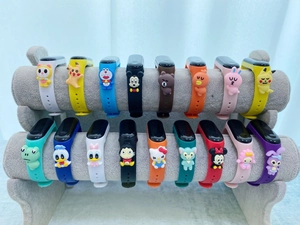 Wholesale cartoon silicone kids watches with various colorful straps and 3D character charms