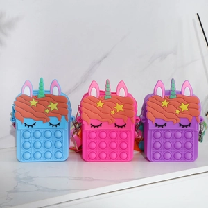 Unicorn silicone pop-it shoulder bags for kids in pink, purple, and blue colors