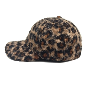 Close-up of leopard print teddy fleece baseball cap with textured fuzzy fabric finish