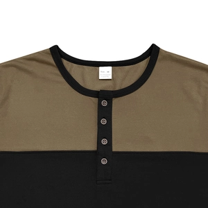 Close-up of color-block Henley neckline with four buttons and ribbed collar detail