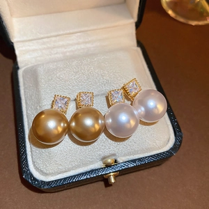 French vintage pearl earrings with square zircons in a jewelry box, gold and white set