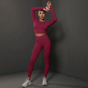 Women's burgundy seamless yoga set with long sleeve crop top and high waist leggings
