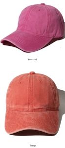 Detailed macro view of rose red and orange vintage washed cotton baseball caps fabric