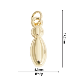 Macro view of gold balloon pendant with 17.2mm height and 5.7mm width measurements