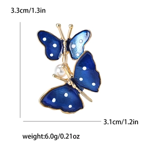 Detail view of blue enamel butterfly brooch with dimensions 3.3cm and 6g weight