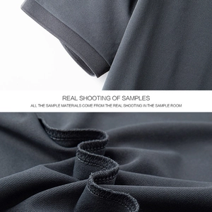 Detail of dark gray polo shirt showing ribbed cuffs and high-density inner stitching