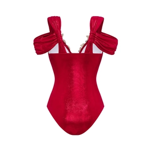 Detailed view of red metallic one-piece swimsuit with ruffle shoulder and lace trim