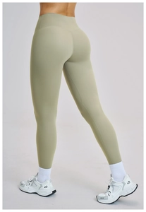 Detail of V-shaped back stitching on sage green high-waisted yoga leggings
