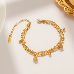 Golden double-layered stainless steel bracelet featuring round and square chain links
