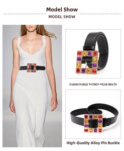 Detail of square alloy buckle with multi-color rhinestones on a black leather belt