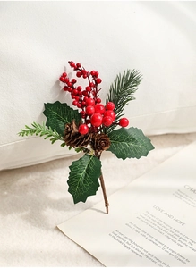 Detail of Christmas spray with red berries, pine cones and needles for festive decor