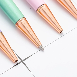 DIY dried flower ballpoint pens in pastel colors with elegant rose gold metal tips