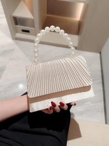 Elegant champagne satin evening clutch bag with pleated flap and pearl bead handle
