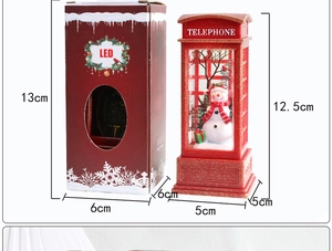 Detailed view of LED Christmas telephone booth lamp with snowman scene and red gift box