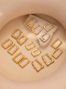Detailed collection of vintage gold geometric earrings in luxurious heart and bamboo styles