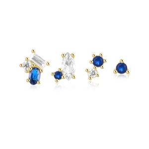 Macro detail of 4-piece 925 silver stud set with blue and white stones on white base