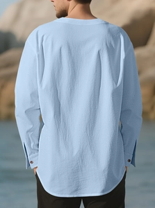 Rear view of light blue linen-blend casual long-sleeve shirt with curved hem detail