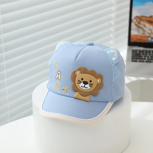 Detail of light blue baby baseball cap featuring cartoon lion patch and cute ears